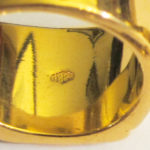 The "18 kt" hallmark on one of the rings